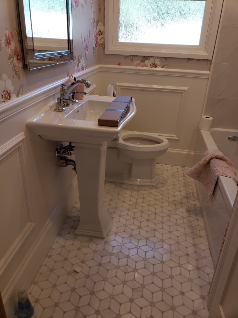 Bathroom remodel with pedestal sink and tile