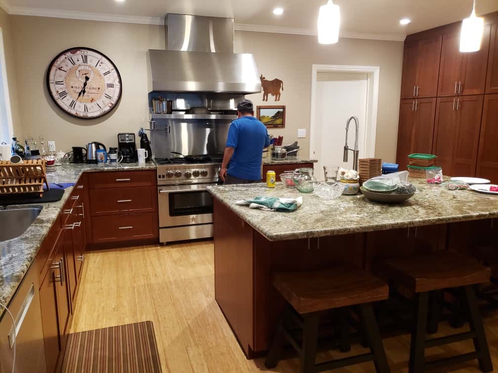 Kitchen with dark wood cabinets and granite